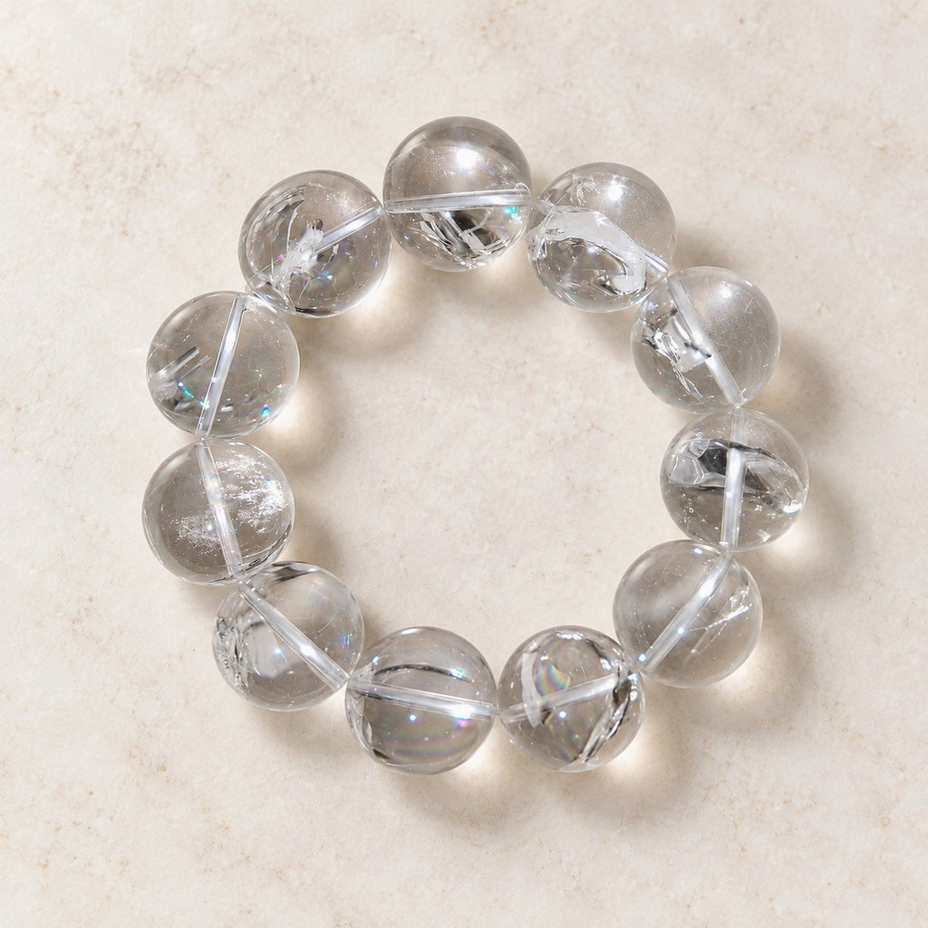 Natural Crystal Bracelet #01 — Clear & Smoky — clear front product view on warm ivory background