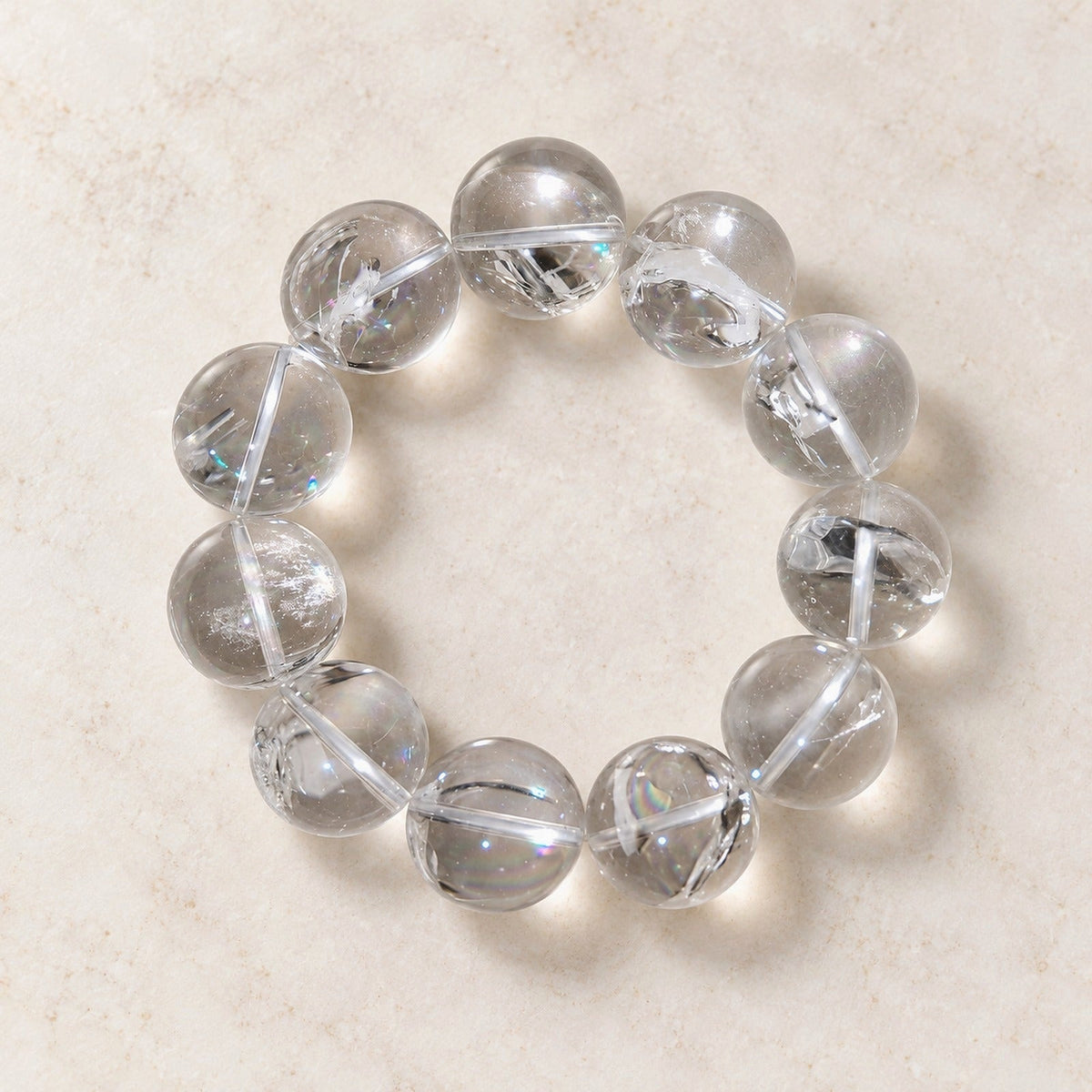 Natural Crystal Bracelet #01 — Clear & Smoky — clear front product view on warm ivory background