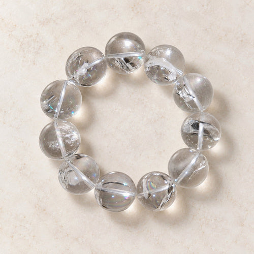 Natural Crystal Bracelet #01 — Clear & Smoky — clear front product view on warm ivory background