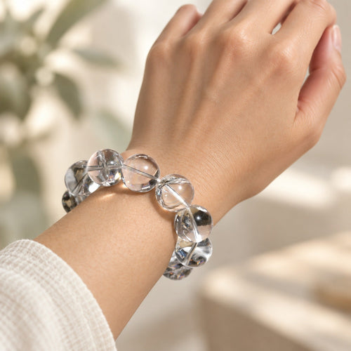 Natural Crystal Bracelet #01 — Clear & Smoky — styled on a woman's wrist