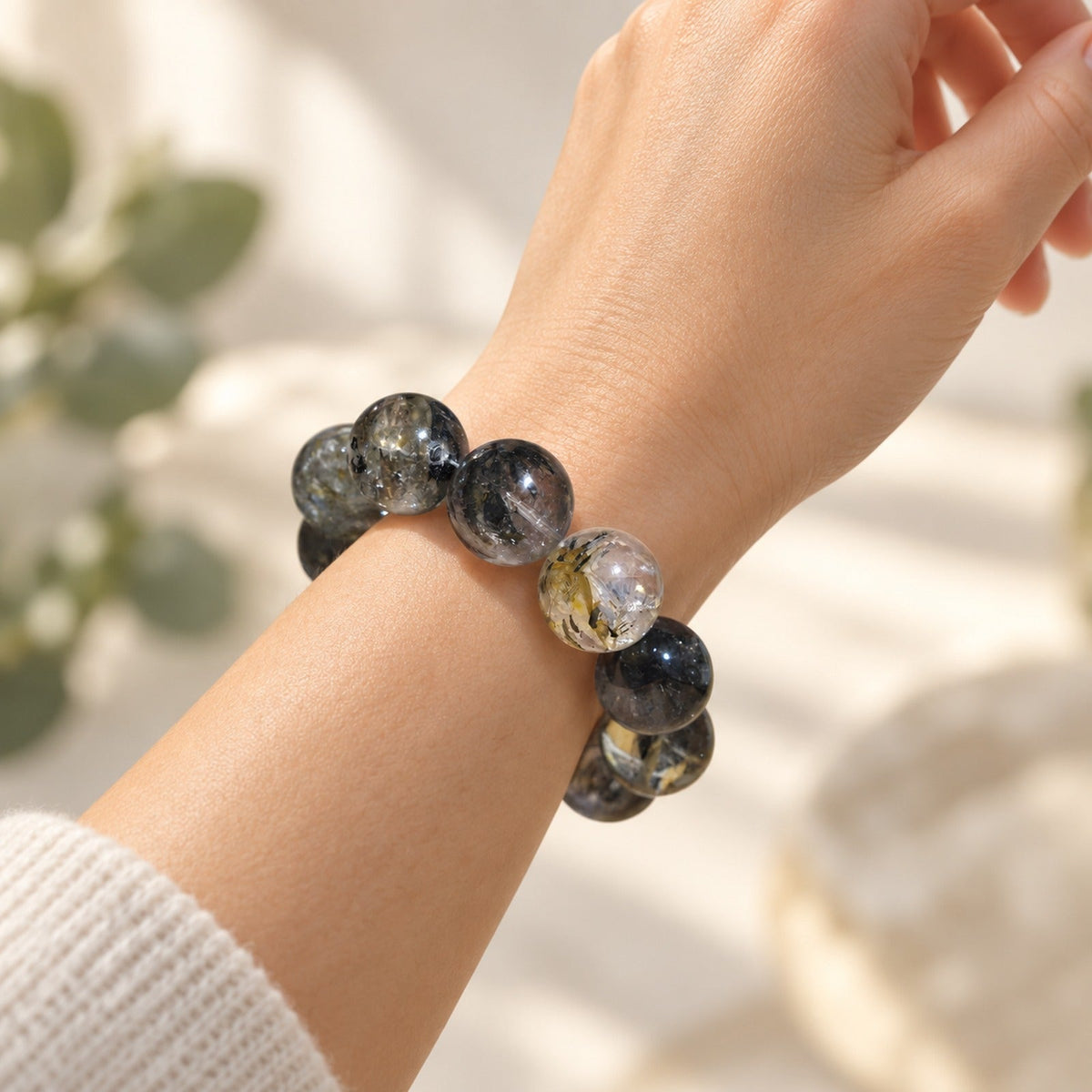 Natural Crystal Bracelet #02 — Smoky Garden — styled on a woman's wrist