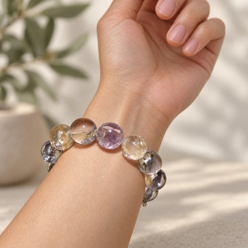 Natural Crystal Bracelet #04 — Golden Mist — styled on a woman's wrist