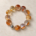 Natural Crystal Bracelet #07 — Amber Bloom — clear front product view on warm ivory background
