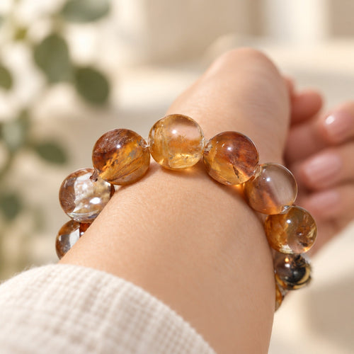 Natural Crystal Bracelet #07 — Amber Bloom — styled on a woman's wrist