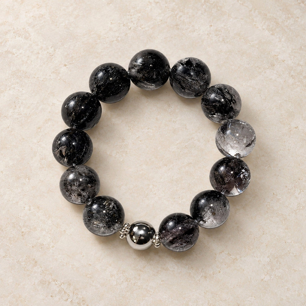 Natural Crystal Bracelet #08 — Midnight Veil — clear front product view on warm ivory background