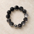 Natural Crystal Bracelet #08 — Midnight Veil — clear front product view on warm ivory background