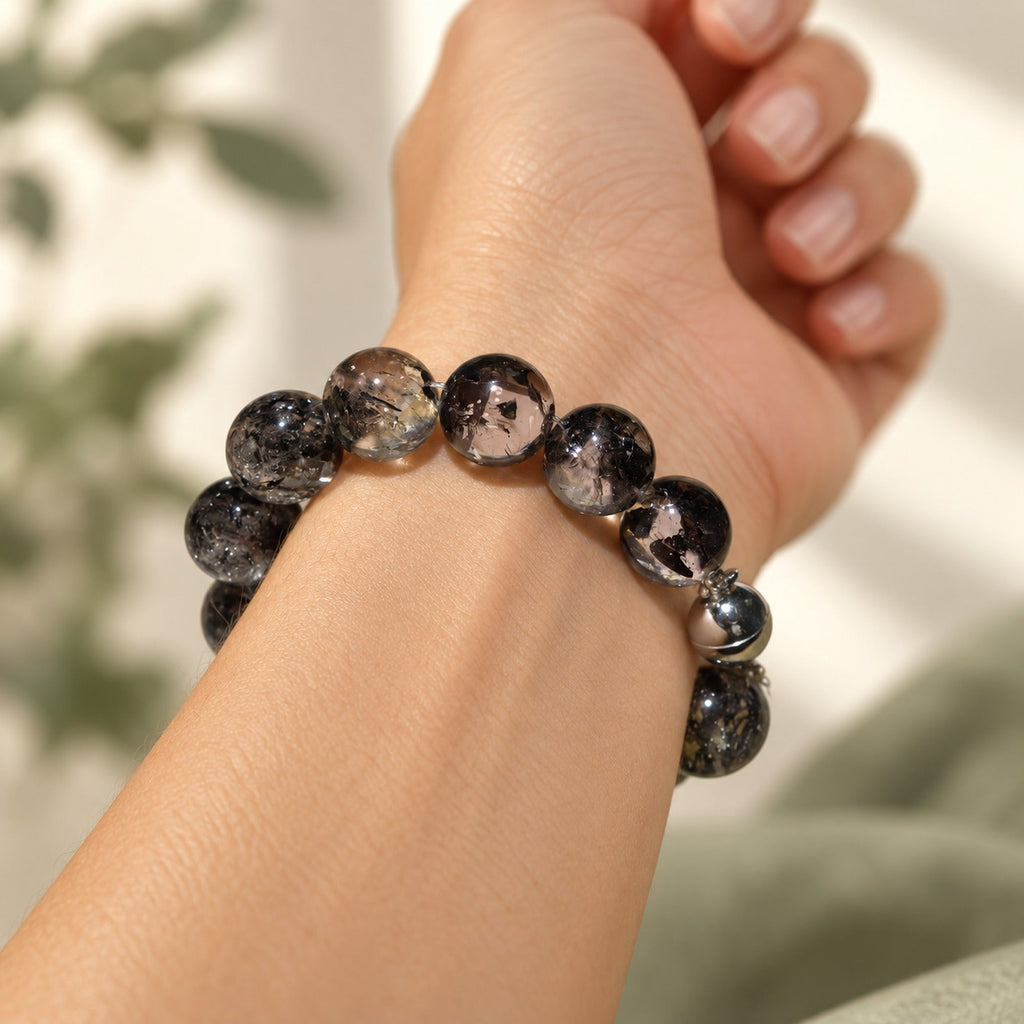 Natural Crystal Bracelet #08 — Midnight Veil — styled on a woman's wrist