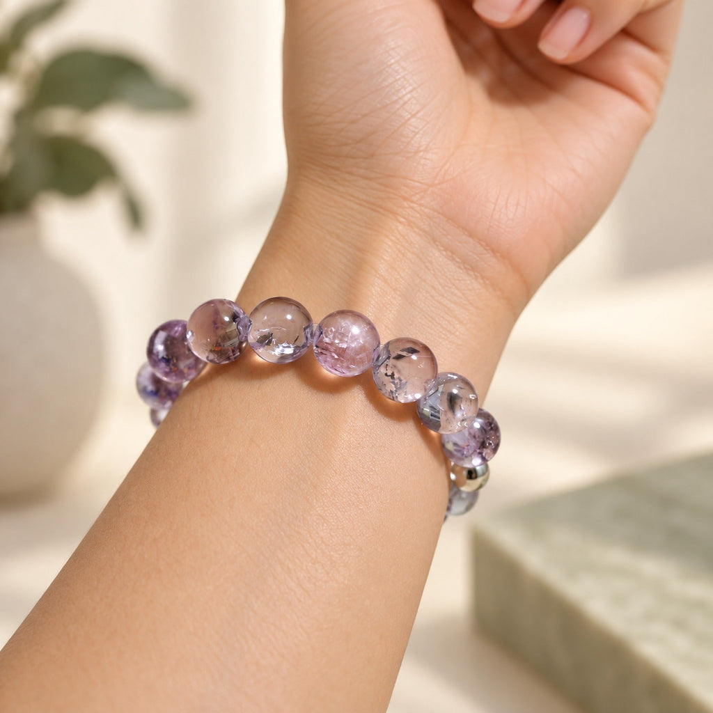 Natural Crystal Bracelet #10 — Lavender Smoke — styled on a woman's wrist